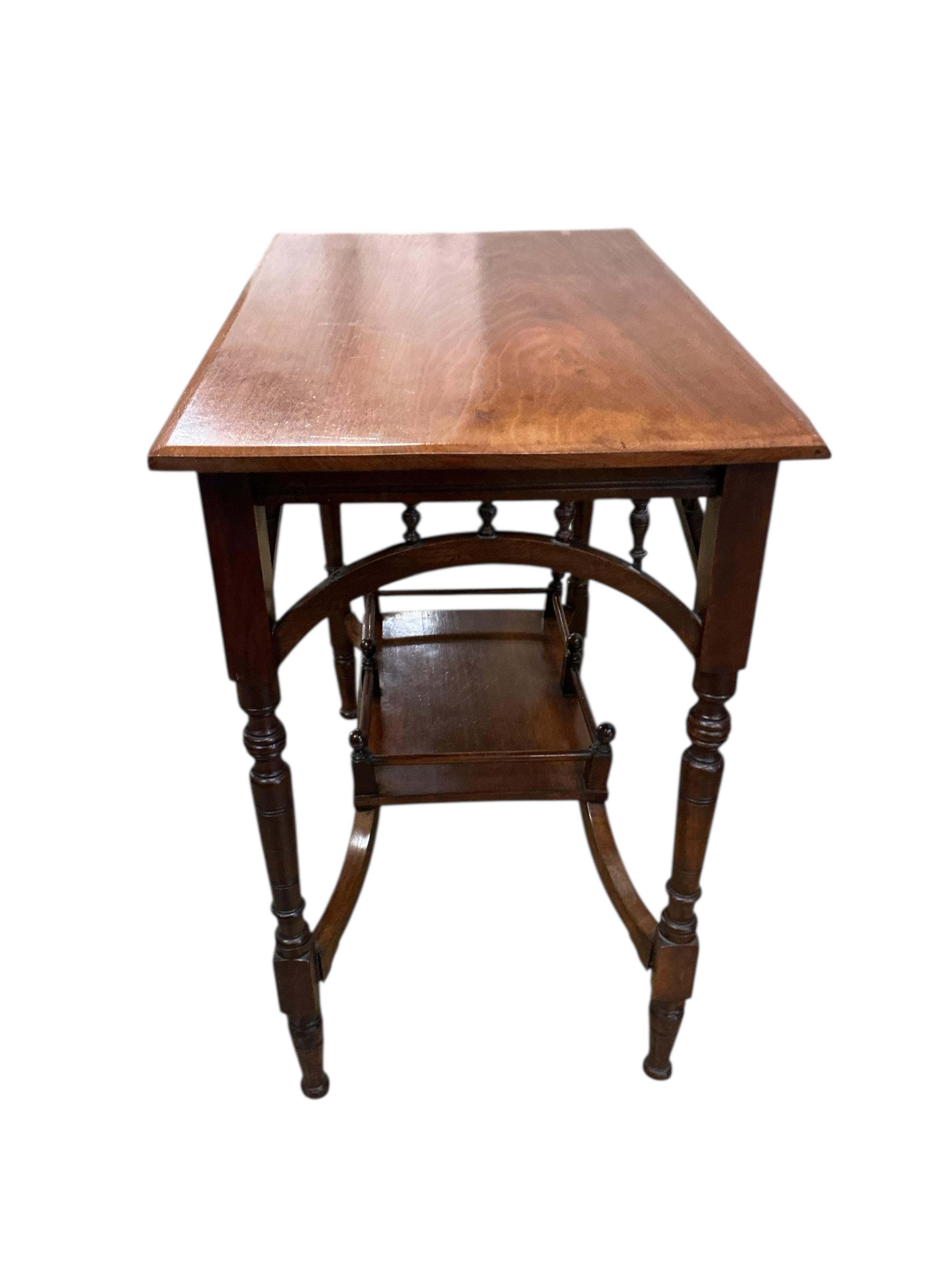 A Victorian Aesthetic Movement rectangular walnut two tier occasional table, width 74cm, depth 44cm, height 69cm